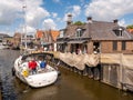 Sailboat near Oudesluis quay in Het Dok canal, Lemmer, Friesland, Netherlands