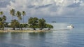 Tropical Islet of Raiatea and Sailboat