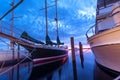 Sailboat parked at marina during sunrise