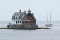 Sailboat Passes Maine Lighthouse