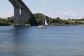 Sailboat Passing the Bridge Royalty Free Stock Photo