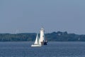 Sailboat passing Great Beds Lighthouse