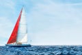 Sailboat in the peaceful blue ocean against sky Royalty Free Stock Photo