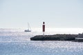 Sailboat and pier with inlet on a bright sunny day Royalty Free Stock Photo