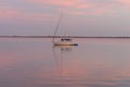 A Sailboat in the Pink Sky of Sunrise