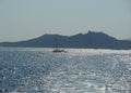 Sailboat on quiet sea on sunny summer day