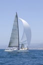 Sailboat Racing In The Blue Ocean Against Sky Royalty Free Stock Photo