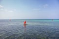 Sailboat with red sail on the sea. Reggata concept. Marine race. Yacht with red sail on tropical seascape. Summer recreation.