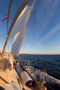 Sailboat during the regatta at sunset ocean Royalty Free Stock Photo