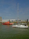 Sailboat and rescue service boat in the harbor of Ostend, belgium Royalty Free Stock Photo