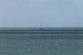 Sailboat riding the choppy waves off the cornish coast Royalty Free Stock Photo