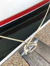 Sailboat rope tied  to a dock cleat in a marina Royalty Free Stock Photo