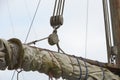 Sailboat ropes wooden pulley rigs. Part of a sail boat. Close-up view of sailboat ropes, pulleys and ropes on the mast, Yachting s Royalty Free Stock Photo