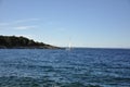 Sailboat in the rough sea with horizon line in background. Island Losinj yacht destination on Adriatic Sea. Royalty Free Stock Photo