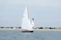 Sailboat sailing past Great Point Lighthouse in Nantucket