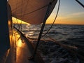 Sailboat sailing at sunrise