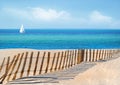 Sailboat and Sand Dune Fence Royalty Free Stock Photo