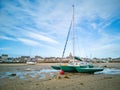 Sailboat on the sand at low tide, village of the Croisic on Guerande peninsula France Royalty Free Stock Photo