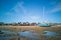 Sailboat on the sand at low tide, village of the Croisic on Guerande peninsula France Royalty Free Stock Photo
