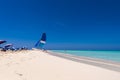 Sailboat on the sandy beach of the Playa Paradise of the island of Cayo Largo, Cuba. Copy space for text. Royalty Free Stock Photo