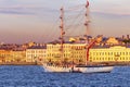 The sailboat `Scarlet sails` in front of the English embankment on a summer evening