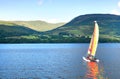 Sailboat on a Scottish loch Royalty Free Stock Photo