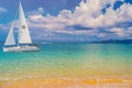 Sailboat in the sea in the evening sunlight over beautiful big mountains background, luxury summer adventure, active vacation in