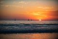 Sailboat at sea. Sunrise over the sea and beautiful cloudscape. Colorful ocean beach sunset. Royalty Free Stock Photo