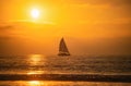 Sailboat at sea. Sunset at the sea. Sunrise on beach. Colorful ocean, nature landscape background with copy space. Royalty Free Stock Photo