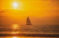 Sailboat at sea. Sunset at the sea. Sunrise on beach. Colorful ocean, nature landscape background with copy space. Royalty Free Stock Photo