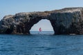 Sailboat framed byArch Rock on Anacapa Island Royalty Free Stock Photo