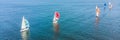 Sailboat shot from above showing the clear blue water of the ocean BANNER, LONG FORMAT