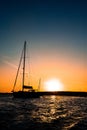 Sailboat silhouette anchored at the island of Ibiza during sunset Royalty Free Stock Photo