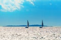 Sailboat silhouettes in a nice summer day