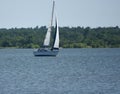 Sailboat, single mast, early afternoon sun, Lake Hefner