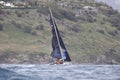 A sailboat sinking into the sea among the waves in a stormy weather. Before that, two boats collide. Royalty Free Stock Photo