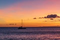 Sailboat sitting in the Pacific Ocean during a beautiful Hawaiian sunset Royalty Free Stock Photo