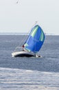 Sailboat with spinnaker billowing in breeze