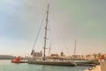 sailboat, steamship and tug moored at the pier