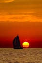 Sailboat in the sunset. Royalty Free Stock Photo