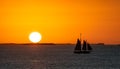 Sailboat at sunset by the coast of Key West Royalty Free Stock Photo