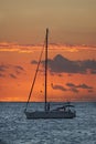 Sailboat at sunset in the ocean, tranquility