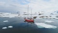 Sailboat travel in antarctica iceberg ocean aerial