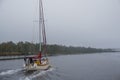 Sailboat travels in fog on the ICW