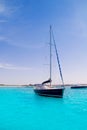 Sailboat in turquoise beach of Formentera Royalty Free Stock Photo