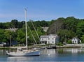 Sailboat and waterfront houses Royalty Free Stock Photo