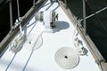 Sailboat white bow with bollard and spiral rope