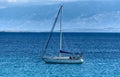 Sailboat yacht is moored in the sea bay. Royalty Free Stock Photo