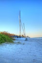 Sailboats along the sand at Sunrise at Vanderbilt Beach Royalty Free Stock Photo