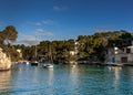 sailboats at anchor in a small cove in the Cala Figuera harbor on Mallorca in warm morning light Royalty Free Stock Photo